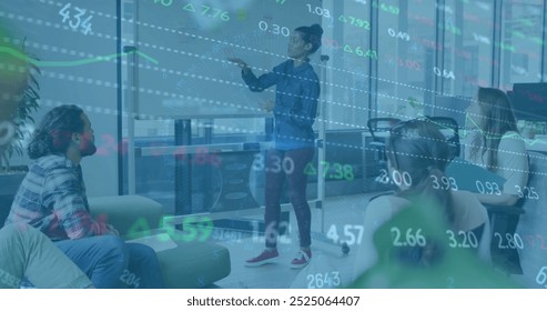 Image of financial data processing over diverse colleagues having meeting in office. Global business, finances, computing and digital interface concept digitally generated image.