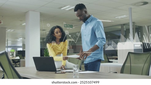 Image of financial data processing over diverse colleagues discussing work in office. Global business, finances, computing and digital interface concept digitally generated image.
