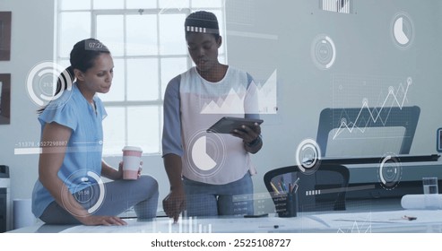 Image of financial data processing over diverse colleagues discussing work in office. Global business, finances, computing and digital interface concept digitally generated image.