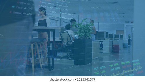 Image of financial data processing over diverse business people in office. Global finance, business, connections, computing and data processing concept digitally generated image.