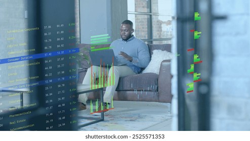 Image of financial data processing over afrcian american businessman in office. Global finance, business, connections, computing and data processing concept digitally generated image.