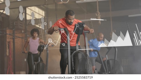 Image of financial data processing over diverse people using elliptical bikes on gym. Global computing, finances, sports, communication and digital interface concept digitally generated image. - Powered by Shutterstock