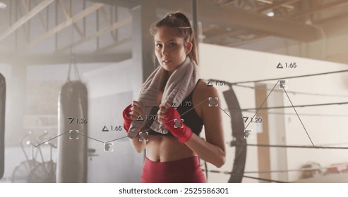 Image of financial data processing over biracial female boxer. Global computing, finances, sports, communication and digital interface concept digitally generated image. - Powered by Shutterstock