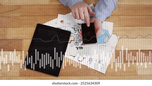 Image of financial data processing over caucasian man using tablet and smartphone. Global connections, business, finances, computing and data processing concept digitally generated image.
