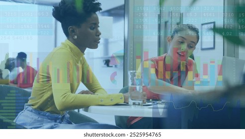 Image of financial data processing over diverse business people in office. Global business, finances, computing and data processing concept digitally generated image.