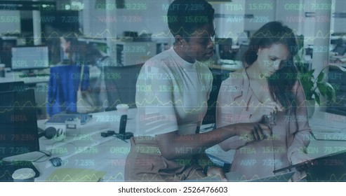 Image of financial data processing over diverse business people in office. Global business, finance, computing and data processing concept digitally generated image. - Powered by Shutterstock - Get 15% off with code: PIKWIZARD15