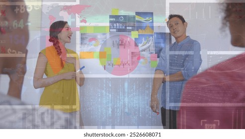 Image of financial data processing over diverse business people working at office. Global business, finances and digital interface concept digitally generated image.