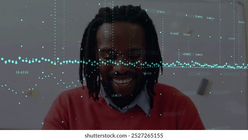 Image of financial data processing over african american businessman in office. Global business, finances, computing and digital interface concept digitally generated image.