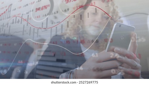 Image of financial data processing over caucasian businesswoman using smartphone. Global finance, business, connections, computing and data processing concept digitally generated image.