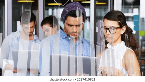 Image of financial data processing over diverse business people using laptops. global business, finance, data processing and digital interface concept digitally generated image. - Powered by Shutterstock