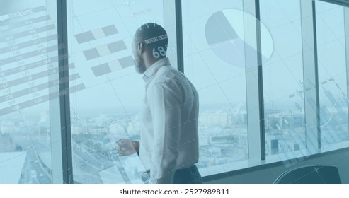 Image of financial data processing over african american businessman thinking. global business, finances and digital interface concept digitally generated image.