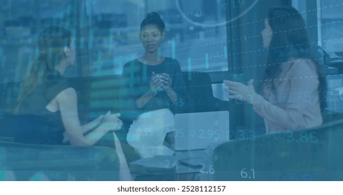 Image of financial data processing over diverse colleagues having meeting in office. Business, finances, teamwork and digital interface concept digitally generated image.