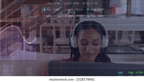 Image of financial data processing over biracial woman with laptop. Global business, finance, connections, technology and data processing concept digitally generated image.
