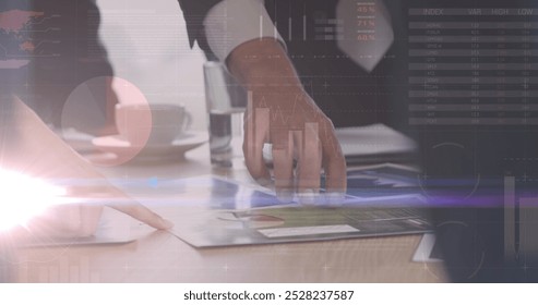 Image of financial data processing over working business people. global business, finances, data processing and digital interface concept digitally generated image.