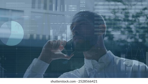 Image of financial data processing over caucasian man using smartphone. Global computing, digital interface and data processing concept digitally generated image.