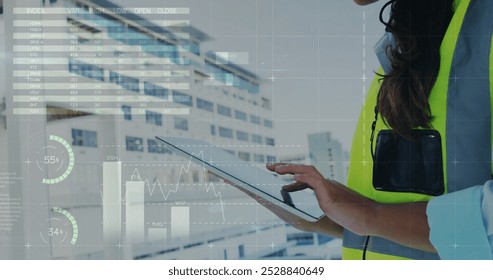 Image of financial data processing over biracial female architect using tablet. Global business, connections, computing and data processing over concept digitally generated image. - Powered by Shutterstock