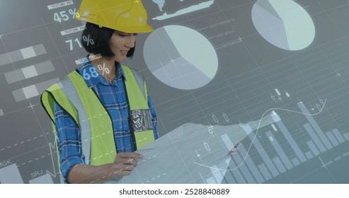 Image of financial data processing over biracial female architect using tablet. Global business, connections, computing and data processing over concept digitally generated image. - Powered by Shutterstock