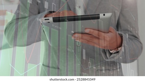 Image of financial data processing over caucasian businessman using tablet. Global business, connections, computing and data processing over concept digitally generated image.