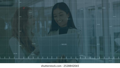 Image of financial data processing over diverse colleagues discussing work in office. Global business, finances, computing and digital interface concept digitally generated image.