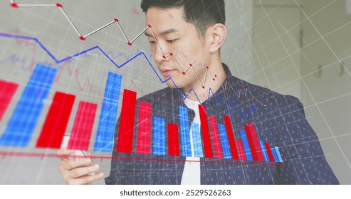 Image of financial data processing over caucasian businessman using smartphone. Global finance, business, connections, computing and data processing concept digitally generated image.