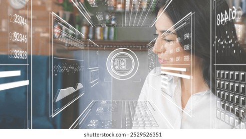 Image of financial data processing over caucasian businesswoman using laptop. Global finance, business, connections, computing and data processing concept digitally generated image.
