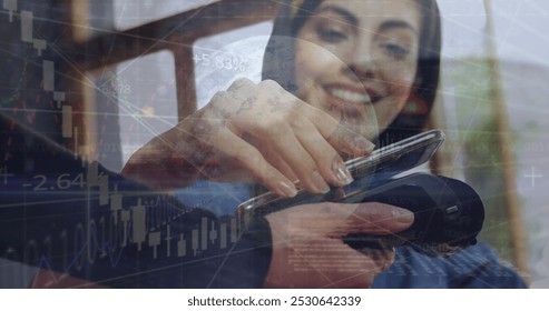 Image of financial data processing over people using smartphone and payment terminal. Global business and data processing concept digitally generated image. - Powered by Shutterstock - Get 15% off with code: PIKWIZARD15