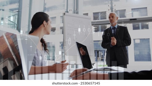 Image of financial data processing over diverse business people. global business, data processing and digital interface concept digitally generated image. - Powered by Shutterstock