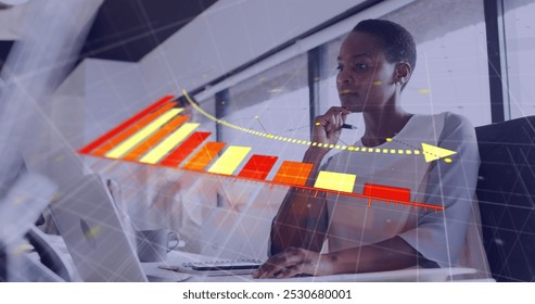 Image of financial data processing over african american businesswoman in office. Global business, finances, computing and data processing concept digitally generated image.