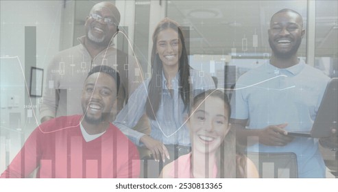 Image of financial data processing over diverse business people working at office. Global business, finances and digital interface concept digitally generated image.