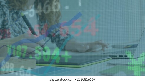 Image of financial data processing over woman in office using graphic tablet. global finance and business, connection concept digitally generated image.