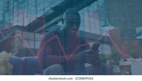 Image of financial data processing over african american businessman using smartphone. Global finance, business, connections, computing and data processing concept digitally generated image.