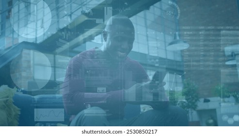 Image of financial data processing over african american businessman using smartphone. Global finance, business, connections, computing and data processing concept digitally generated image.