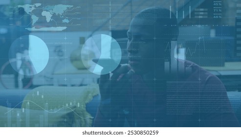 Image of financial data processing over african american businessman using smartphone. Global finance, business, connections, computing and data processing concept digitally generated image.