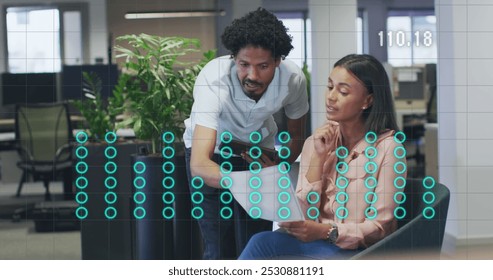 Image of financial data processing over diverse business people discussing work at office. Global business, finances and digital interface concept digitally generated image.