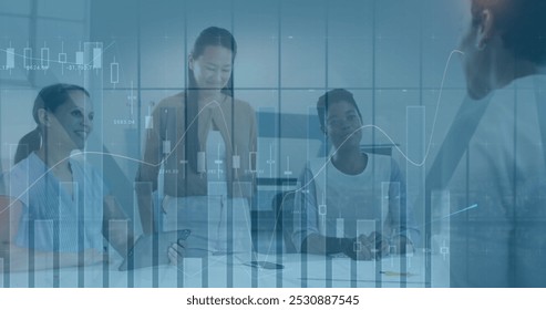 Image of financial data processing over diverse business people in office. Global business and digital interface concept digitally generated image. - Powered by Shutterstock