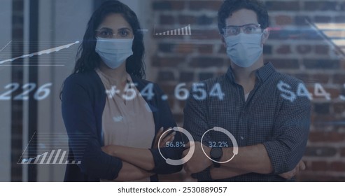 Image of financial data processing over people wearing face masks. global business, finances, connections and digital interface during covid 19 pandemic concept digitally generated image.