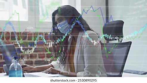 Image of financial data processing over businesswoman wearing face mask. global business, finances, connections and digital interface during covid 19 pandemic concept digitally generated image. - Powered by Shutterstock