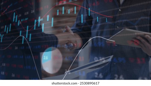 Image of financial data processing over business people shaking hands in office. global business, finances, connections and digital interface concept digitally generated image.