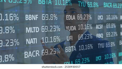 Image of financial data processing over businessman. global business, data processing and digital interface concept digitally generated image.