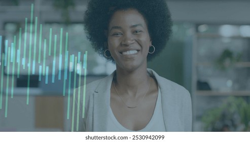 Image of financial data processing over african american businesswoman in office. Global business, finance, computing and data processing concept digitally generated image.