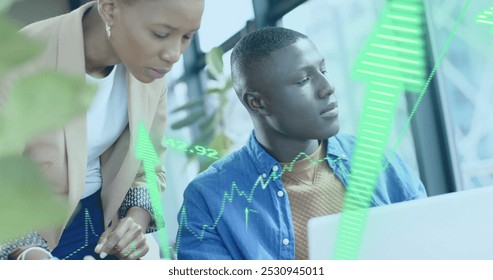 Image of financial data processing over diverse businesspeople working in office. Global business, finance, computing and data processing concept digitally generated image.
