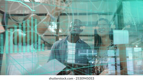 Image of financial data processing over diverse businesspeople working in office. Global business, finance, computing and data processing concept digitally generated image.