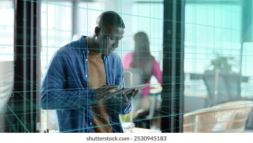 Image of financial data processing over african american businessman working in office. Global business, finance, computing and data processing concept digitally generated image.