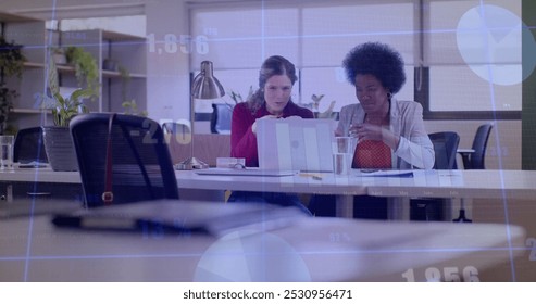 Image of financial data processing over diverse business people in office. Global business, finance, computing and data processing concept digitally generated image.