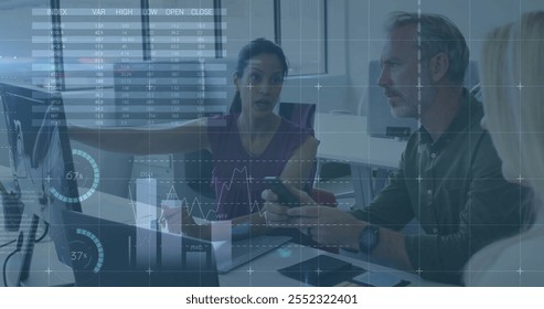 Image of financial data processing over diverse business people in office. Global finance, business, connections, computing and data processing concept digitally generated image. - Powered by Shutterstock