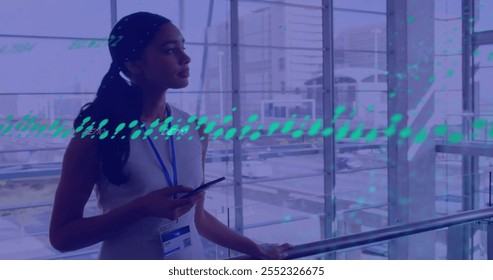 Image of financial data processing over biracial businesswoman using tablet in office. Global finance, business, connections, computing and data processing concept digitally generated image. - Powered by Shutterstock