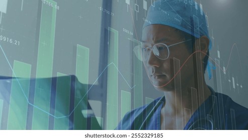 Image of financial data processing over asian male doctor holding x-ray scan. Global medicine, healthcare, computing and digital interface concept digitally generated image. - Powered by Shutterstock