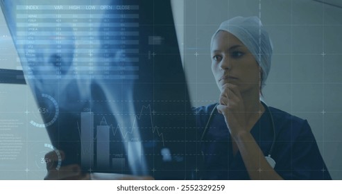 Image of financial data processing over caucasian female surgeon in hospital. Global medicine, healthcare, computing and digital interface concept digitally generated image.
