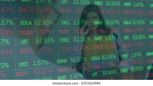 Image of financial data processing over diverse colleagues discussing work in office. Global business, finances and digital interface concept digitally generated image.