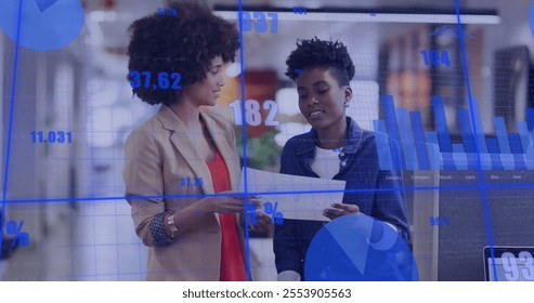 Image of financial data processing over diverse colleagues discussing work in office. Global business, finances and digital interface concept digitally generated image.